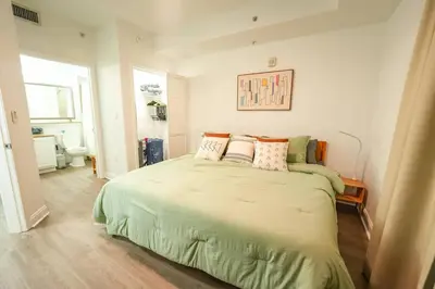 a bedroom with a large bed with pillows on it at Orlando Apt 10th floor 5 min from Disney in Orlando
