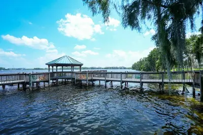 a pier with a gazebo in the water at Apartment 5 min away from Disney 1st Floor in Orlando