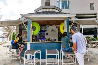 a group of people sitting at a bar at Apt Orlando 11th Floor 5 min from Disney in Orlando