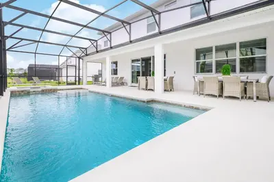 an image of a swimming pool in a house at 15BR Mansion Near Disney Private Pool Hot Tub in Kissimmee