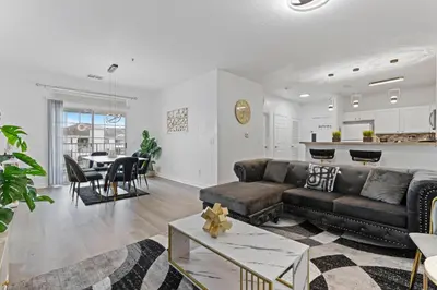 a living room with a couch and a table at Amazing Apartment 3Brdm - 5 miles from Disney in Kissimmee