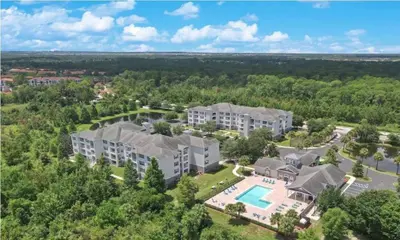 an aerial view of an apartment complex with a pool at Amazing Apartment 3Brdm - 5 miles from Disney in Kissimmee