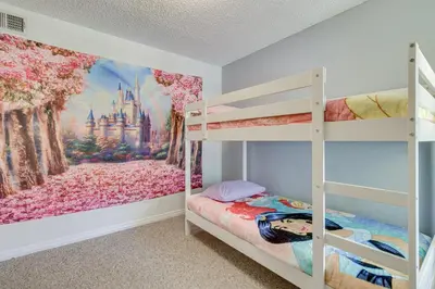 a bedroom with bunk beds and a castle mural at 6 Mi to Disney Family-Friendly Condo in Kissimmee in Kissimmee