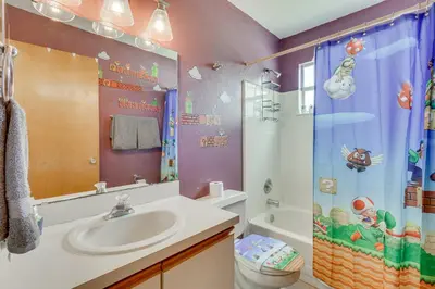 a bathroom with a sink and a shower at 6 Mi to Disney Family-Friendly Condo in Kissimmee in Kissimmee