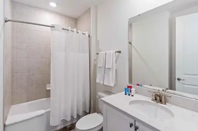a bathroom with a sink and a toilet and a shower at 2959 Castaway Lane in Orlando