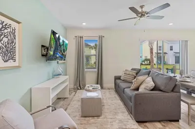 a living room with a couch and a table at 2959 Castaway Lane in Orlando