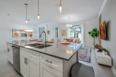a kitchen with a sink and a counter top at Ultimate Luxury Home-Private Pool Themed Bedroom in Kissimmee