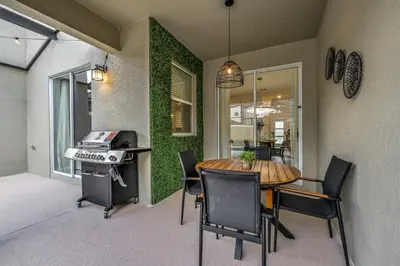a dining room with a table and chairs at Ultimate Luxury Home-Private Pool Themed Bedroom in Kissimmee