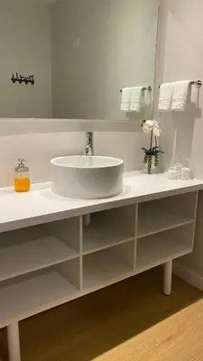 a bathroom with a sink and a mirror at A & S Vacation Rooms in Kissimmee