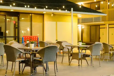 an empty restaurant with tables and chairs at A & S Vacation Rooms in Kissimmee