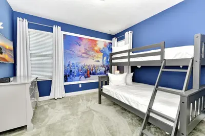 a bedroom with a bunk bed and blue walls at Modern Home With Private Pool, Ping Pong Table Near Disney With Waterpark & Resort Access At Encore Resort - 7758Wl in Kissimmee