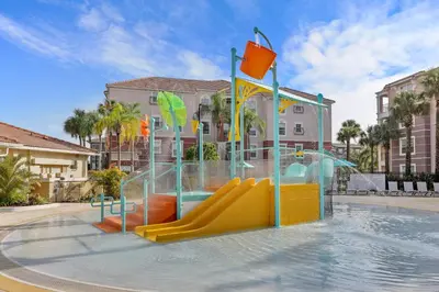 a water park with a slide in a pool at Orlando Resort: 3BD and electric fireplace in Orlando