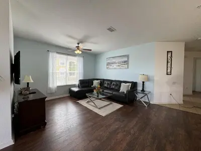 a living room with a couch and a table at Vista Cay Getaway Luxury By Universal Orlando in Orlando