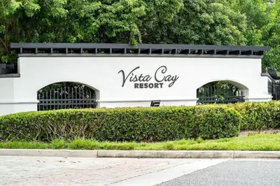 a white building with a sign that reads vista day resort at Vista Cay Getaway Luxury By Universal Orlando in Orlando