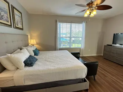 a bedroom with a bed and a ceiling fan at Vista Cay Jewel Luxury By Universal Orlando Rental in Orlando