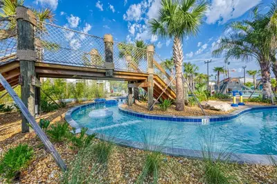 a water park with a slide and a playground at Opulent Retreat Themed Bedrooms and Pool Paradise in Kissimmee