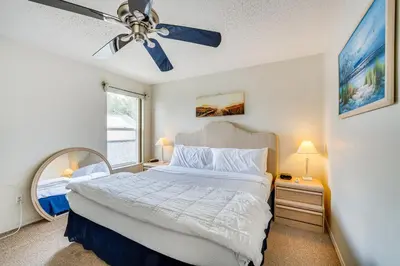 a bedroom with a bed and a ceiling fan at Kissimmee Vacation Rental with Pool about 6 Mi to Disney in Kissimmee