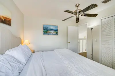 a bedroom with a bed and a ceiling fan at Kissimmee Vacation Rental with Pool about 6 Mi to Disney in Kissimmee