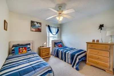 a bedroom with two beds and a ceiling fan at Kissimmee Vacation Rental with Pool about 6 Mi to Disney in Kissimmee