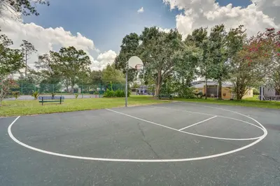 a basketball court with a hoop in a park at Kissimmee Vacation Rental with Pool about 6 Mi to Disney in Kissimmee