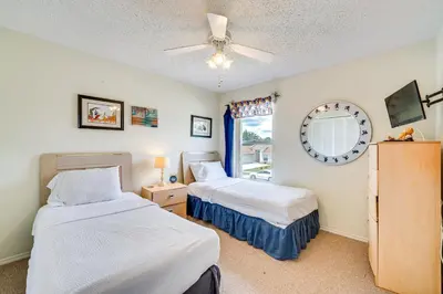 a bedroom with two beds and a window at Kissimmee Vacation Rental with Pool about 6 Mi to Disney in Kissimmee