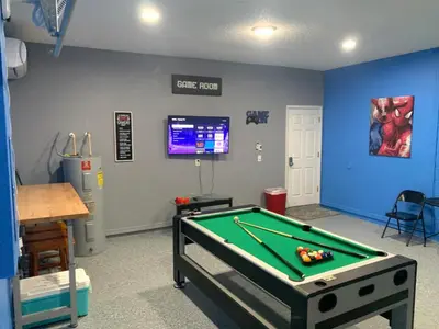 a room with a pool table in a room at Complete Vacation in exclusive 7 Bed resort home, in Kissimmee