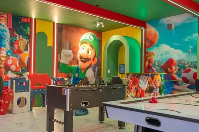 a childrens room with a mario painting on the wall at Lakeview 7Br W pool Disney area in Kissimmee