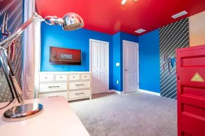a bedroom with blue walls and a red ceiling at Lakeview 7Br W pool Disney area in Kissimmee