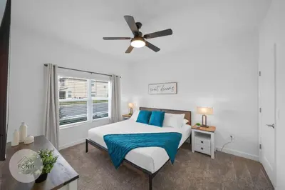 a bedroom with a bed and a ceiling fan at BRAND NEW 4BR House Waterpark Disney Orlando 2697 in Kissimmee