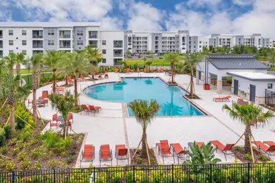 an image of a pool at a resort at Beautiful Apartments 5 Minutes away from Disney! in Kissimmee