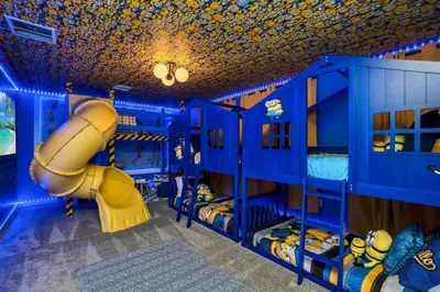 a blue bunk room with a slide and a play room at Luxury Incredible Themed Home best vacation in Kissimmee