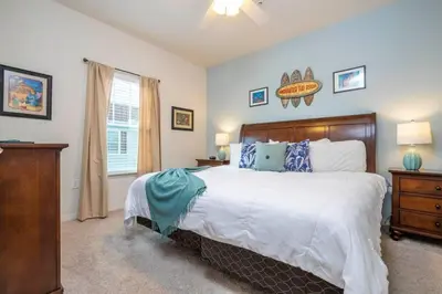 a bedroom with a large bed and a window at Marvelous 4 Bd Close To Disney at West Lucaya 8959 in Kissimmee