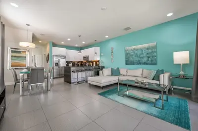 a living room with a couch and a table at Charming Villa with Private Pool Bliss in Orlando