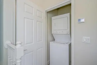 a white laundry room with a washer and dryer at Charming Villa with Private Pool Bliss in Orlando