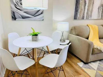 a living room with a table and chairs and a couch at Universal and Convention Center Best Resort Studio in Orlando