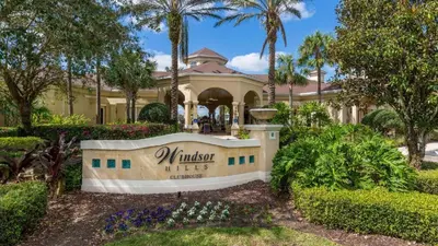 a house with a sign in front of it at Windsor Hills 4BR's Mickeys Ranch Near Disney in Orlando