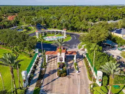 an aerial view of a park with trees and a road at 8538 Crystal Cove in Kissimmee