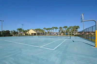a tennis court with a net on top of it at Beautiful 4 beds at Paradise Palms Resort in Kissimmee