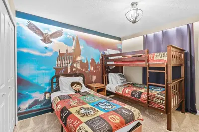 a bedroom with two bunk beds and a castle mural at House with pool in resort in Kissimmee