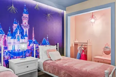 a bedroom with a disney castle on the wall at House with pool in resort in Kissimmee