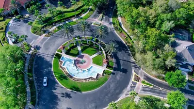 an aerial view of a road with a park at 8569 Crystal Cove in Kissimmee