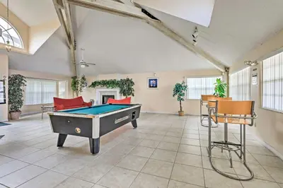 a large room with a pool table in it at Kissimmee Condo with Perks 6 Mi to Disney World! in Kissimmee
