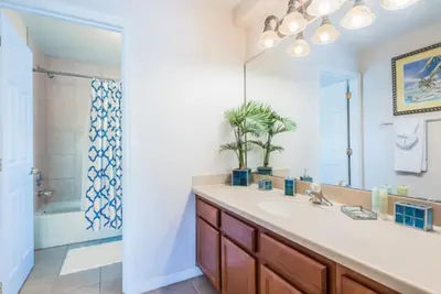 a bathroom with a sink and a shower at Enchanted Villa Oasis in Orlando