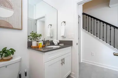 a bathroom with a sink and a mirror at Wonderfull home near Disney & FREE Waterpark 2421 in Kissimmee