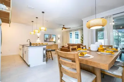 a kitchen and dining room with a table and chairs at Wonderfull home near Disney & FREE Waterpark 2421 in Kissimmee