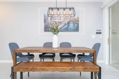 a dining room table with chairs and a vase on it at Amazing Disney resort style & FREE Waterpark 2481 in Kissimmee
