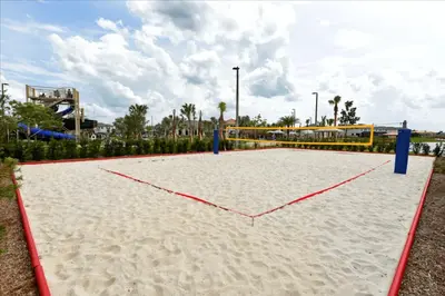 a sand volleyball court with a heart in the middle at Disney adventure resort style free waterpark2633 in Kissimmee