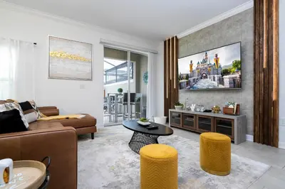 a living room with a couch and a table at Luxury 5BR Storey Lake Retreat Near Disney 2969 in Kissimmee