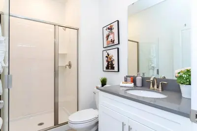 a bathroom with a shower and a toilet and a sink at Luxury 4Bed Near Disney, FreeVIP Resort 4335 in Kissimmee