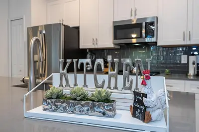 a kitchen with a display of succulents in a counter at Cozy home Near Disney Free resort Access 4463 in Kissimmee